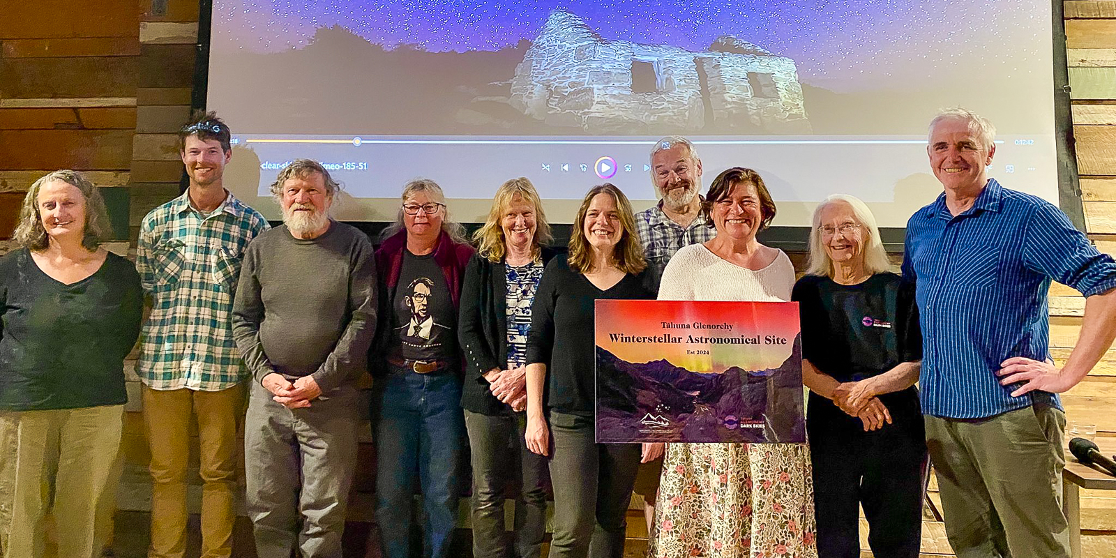 The Tāhuna Glenorchy Astro Site team (L to R: Sue Scott, James Thomson, Tussock Chapman, Shelley Guy, Corrine Davis, Michelle Morss, Chris Hutton, Leslie Van Gelder, Iris Scott) with WCT CEO Andy Davey